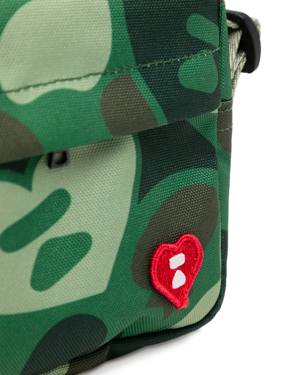 Heart badge crossbody camo mini bag