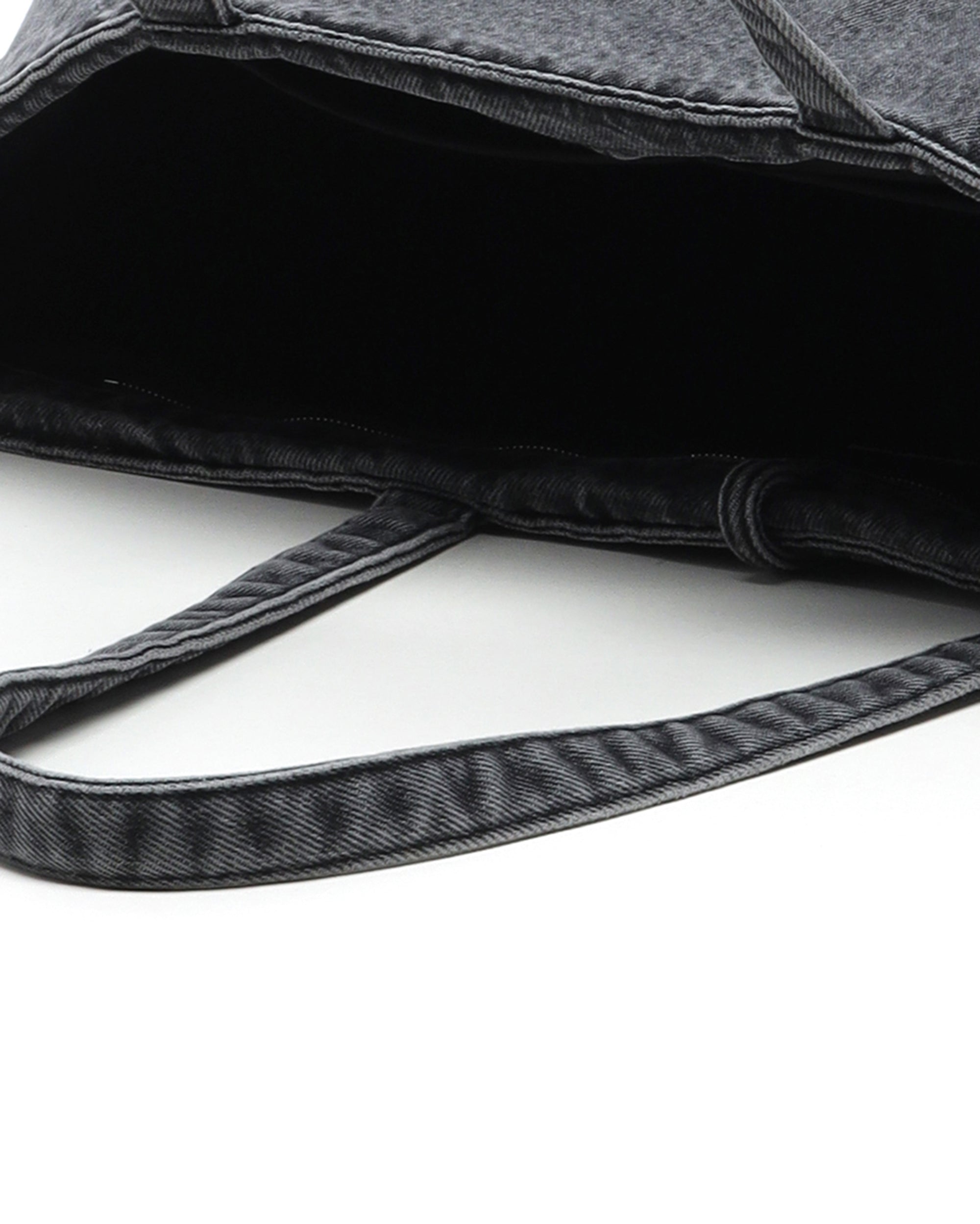 Coated denim punch tote bag