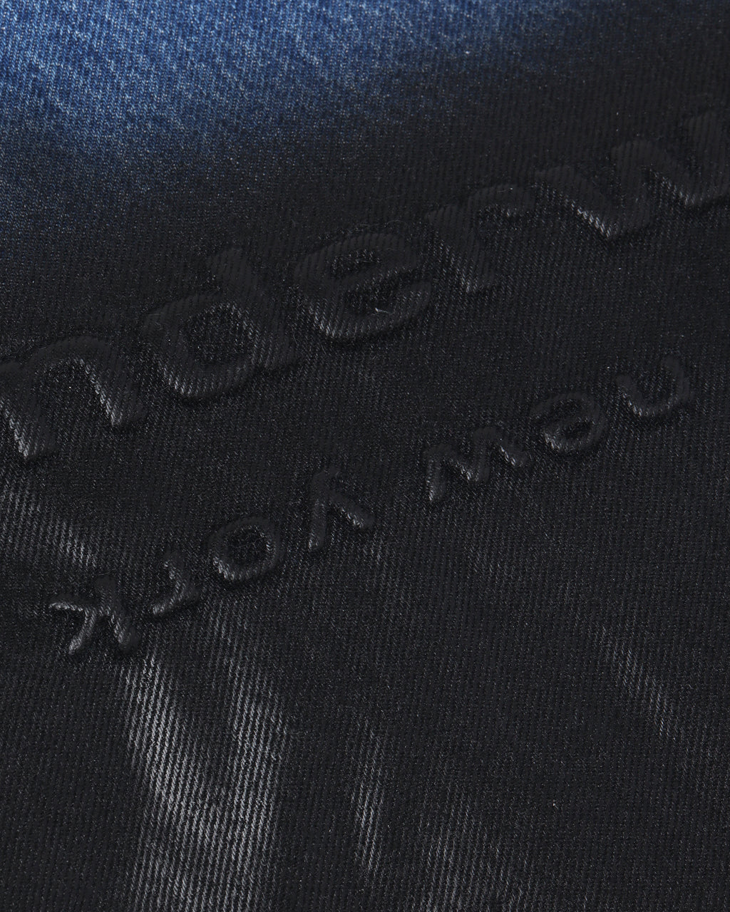 Coated denim punch tote bag