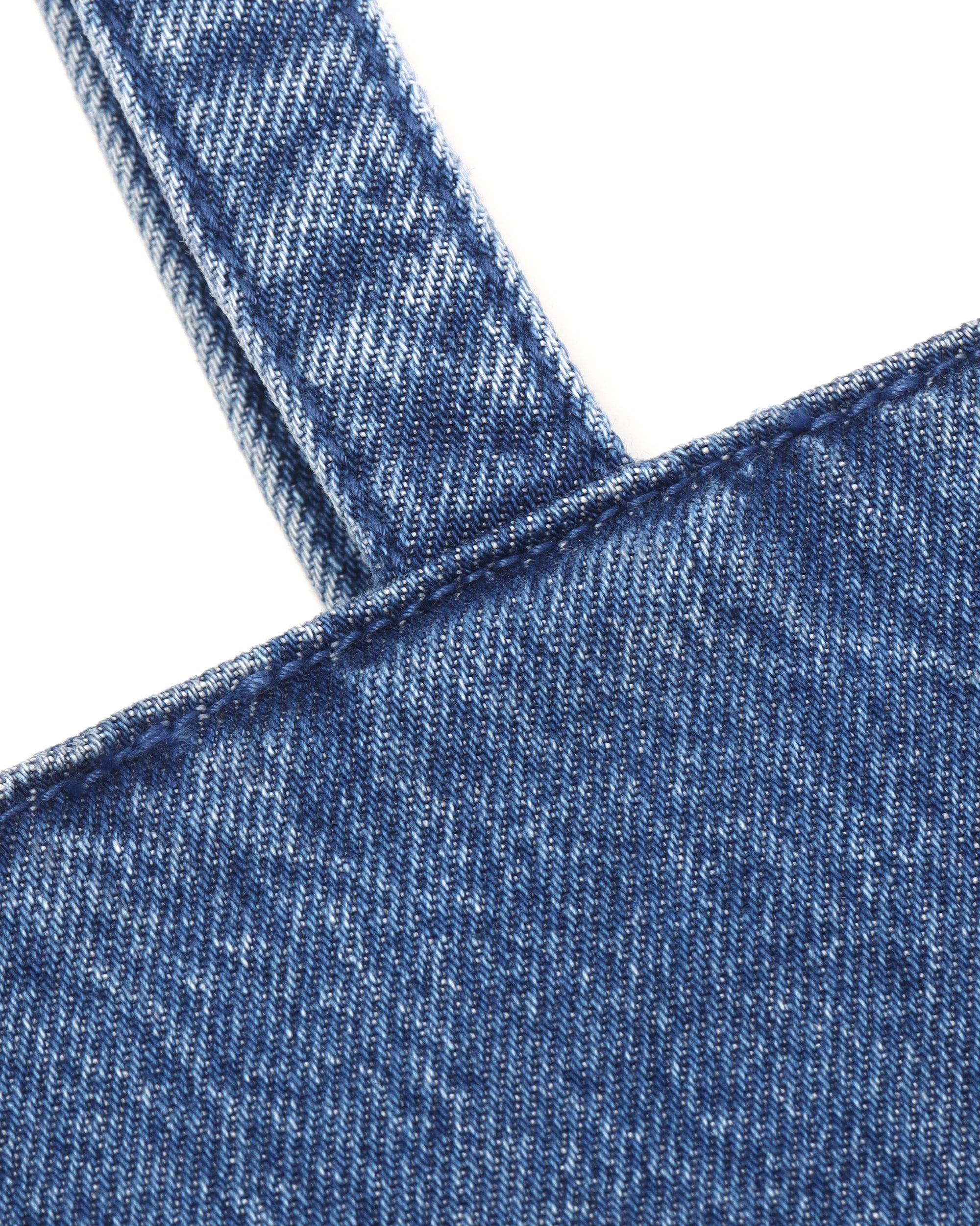 Coated denim punch tote bag