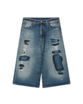 Mended denim shorts