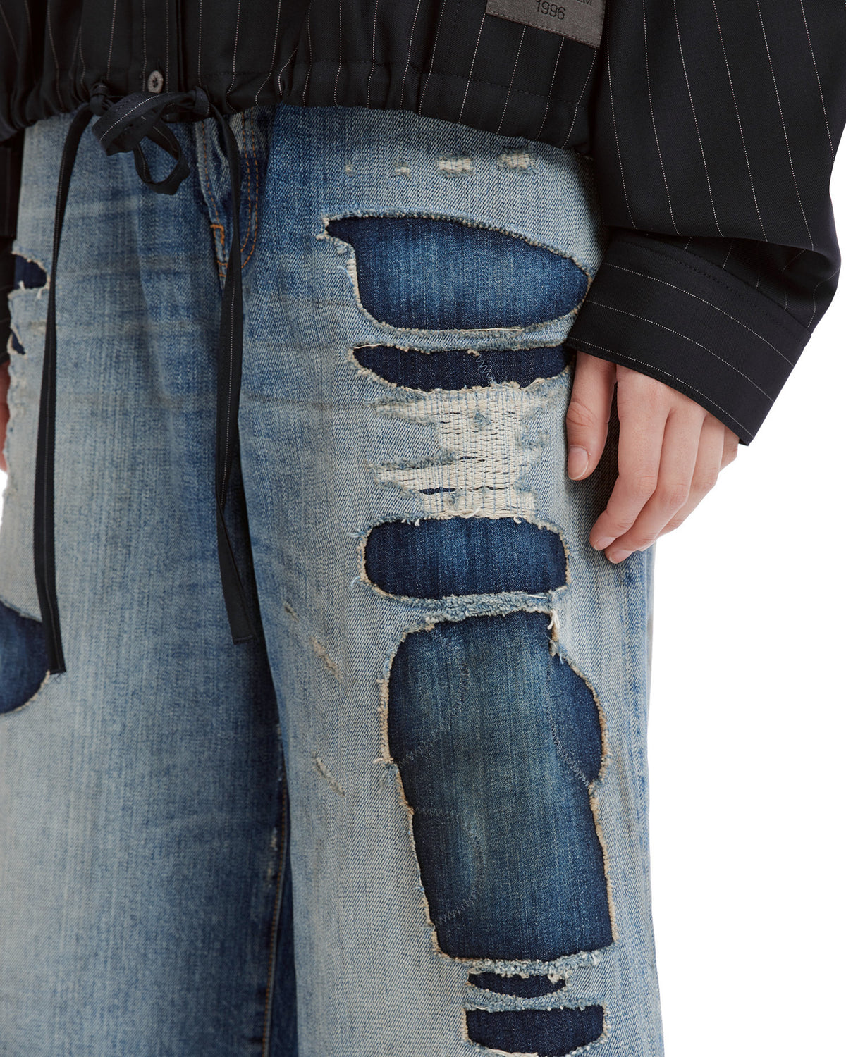 Mended denim shorts