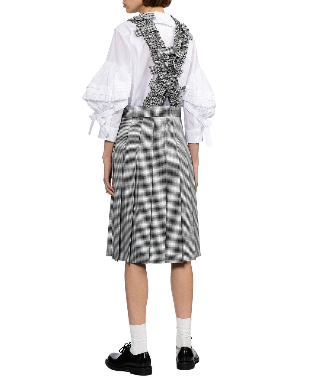 Pleated skirt with suspender straps