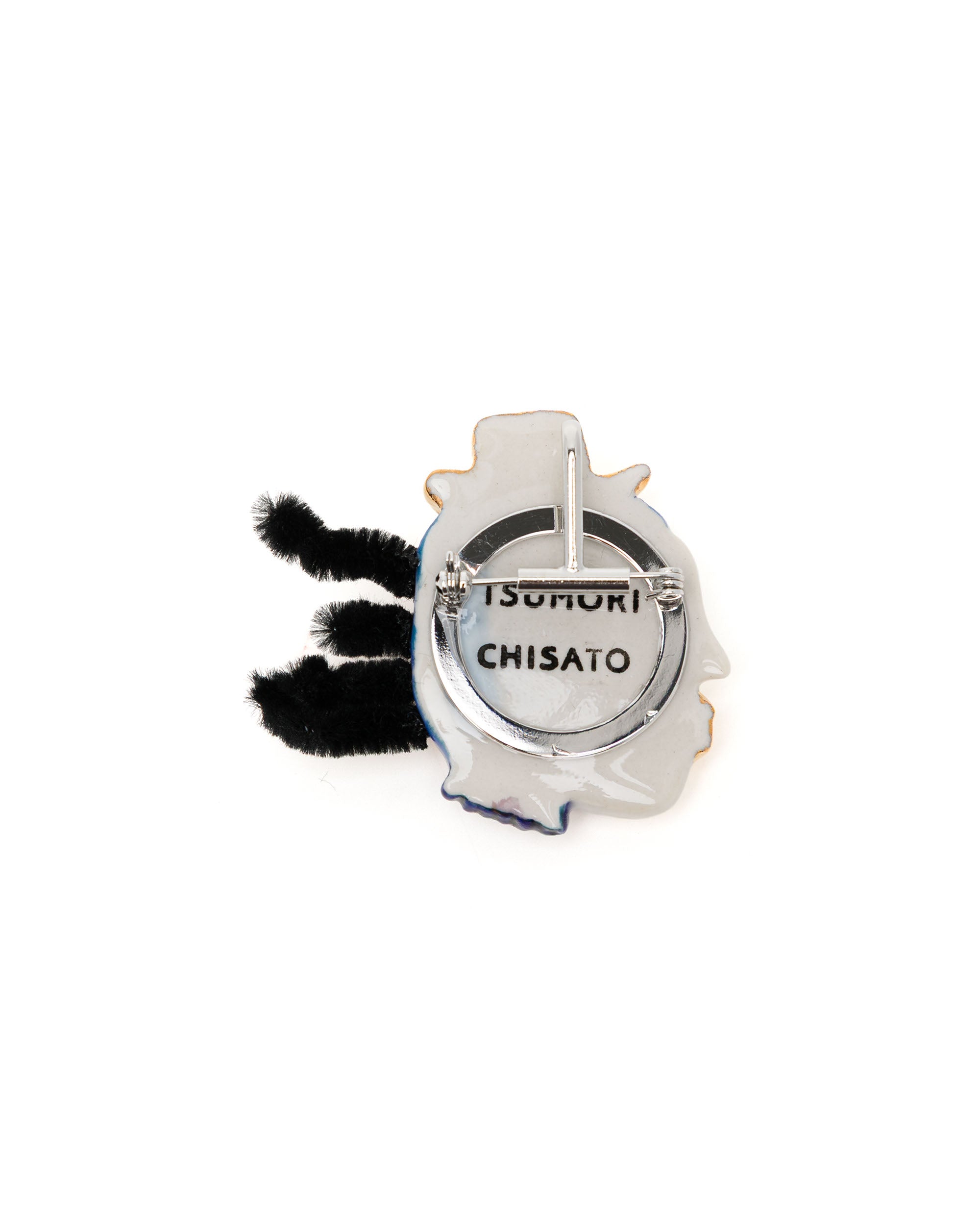 Face brooch